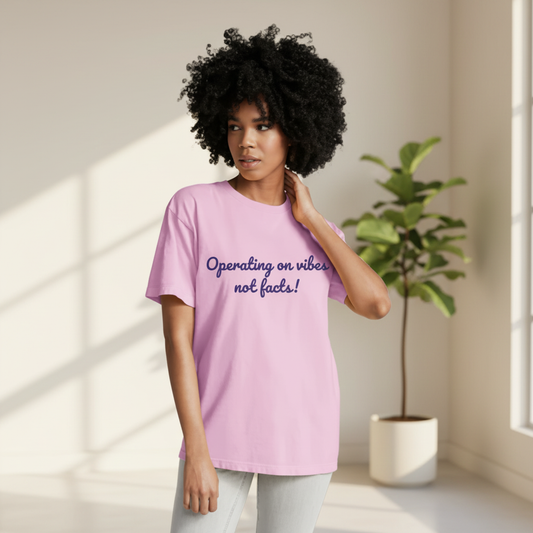 Woman wearing Operating on vibes not facts t-shirt with clean background