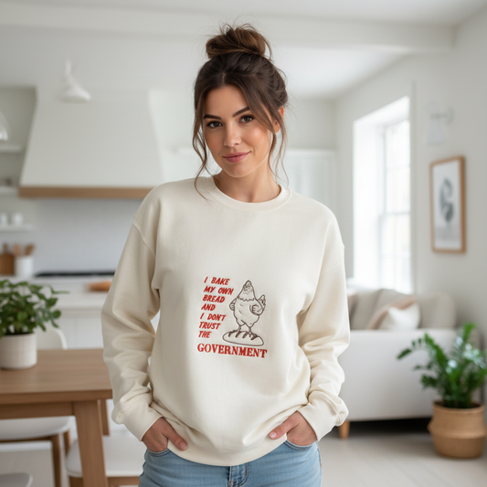 Woman with messy bun wearing I Bake My Own Bread crewneck